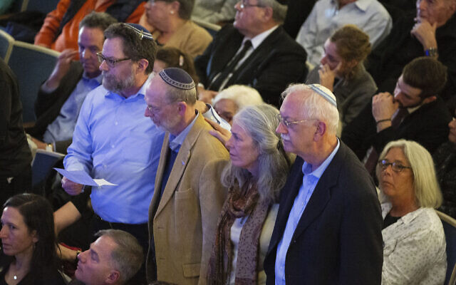 Survivors of the Tree of Life synagogue shooting stand during the one-year commemoration of the Tree of Life synagogue attack at Soldiers & Sailors Memorial Hall and Museum, Sunday, Oct. 27, 2019, in Pittsburgh. (AP Photo/Rebecca Droke) Survivors of the Tree of Life synagogue shooting stand during the one-year commemoration of the Tree of Life synagogue attack at Soldiers & Sailors Memorial Hall and Museum, Sunday, Oct. 27, 2019, in Pittsburgh. (AP Photo/Rebecca Droke)