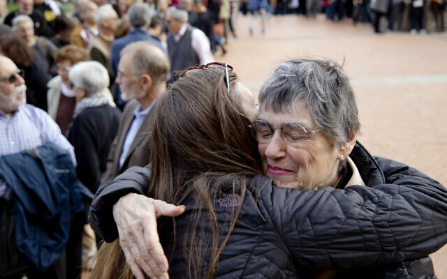 Laura Fehl, left, hugs Esther Nathanson as they arrive for the one-year commemoration of the Tree of Life synagogue attack at Soldiers & Sailors Memorial Hall and Museum, Sunday, Oct. 27, 2019, in Pittsburgh.(AP Photo/Rebecca Droke) Laura Fehl, left, hugs Esther Nathanson as they arrive for the one-year commemoration of the Tree of Life synagogue attack at Soldiers & Sailors Memorial Hall and Museum, Sunday, Oct. 27, 2019, in Pittsburgh.(AP Photo/Rebecca Droke)