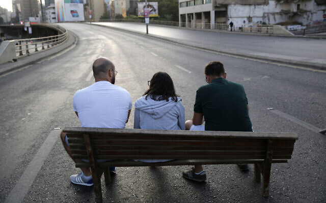 Anti-government protesters sit in the middle of a main highway during ongoing protests against the Lebanese government, in Beirut, Lebanon, October 28, 2019. (AP Photo/Hussein Malla) Anti-government protesters sit in the middle of a main highway during ongoing protests against the Lebanese government, in Beirut, Lebanon, October 28, 2019. (AP Photo/Hussein Malla)