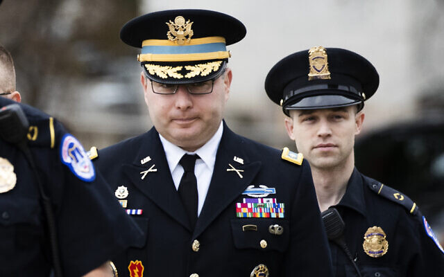 Army Lieutenant Colonel Alexander Vindman, a military officer at the National Security Council, center, arrives on Capitol Hill in Washington, Tuesday, Oct. 29, 2019, to appear before a House Committee on Foreign Affairs, Permanent Select Committee on Intelligence, and Committee on Oversight and Reform joint interview with the transcript to be part of the impeachment inquiry into President Donald Trump. (AP Photo/Manuel Balce Ceneta) Army Lieutenant Colonel Alexander Vindman, a military officer at the National Security Council, center, arrives on Capitol Hill in Washington, Tuesday, Oct. 29, 2019, to appear before a House Committee on Foreign Affairs, Permanent Select Committee on Intelligence, and Committee on Oversight and Reform joint interview with the transcript to be part of the impeachment inquiry into President Donald Trump. (AP Photo/Manuel Balce Ceneta)