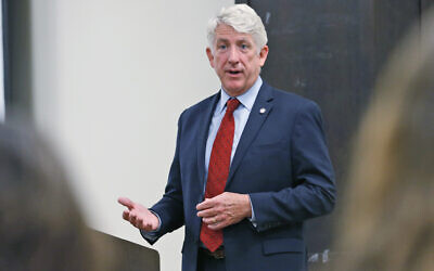 Virginia Attorney General Mark Herring talks with University of Richmond students at the school in Richmond, Virginia, October 4, 2017. (AP Photo/Steve Helber)