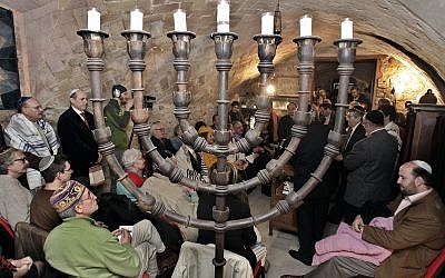 Illustrative: Members of the the restored Synagogue of Barcelona assist at the welcoming of a new torah in Barcelona, Spain, Sunday, January 22, 2006. (AP/Manu Fernandez)