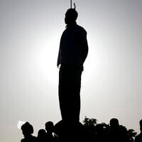 In this May 26, 2011 file photo, the body of convicted man Mahdi Faraji hangs at the city of Qazvin about 80 miles (130 kilometers) west of the capital Tehran, Iran. (AP Photo/Mehr News Agency, Hamideh Shafieeha,)