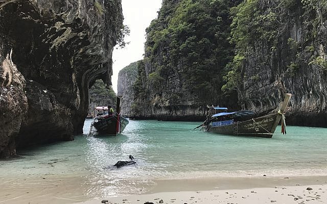 Illustrative -- In this Dec. 5, 2016 photo, long-tail boats sit near a small beach on Ko Phi Phi Leh, an island off the southwestern coast of Thailand (AP Photo/Courtney Bonnell) Illustrative -- In this Dec. 5, 2016 photo, long-tail boats sit near a small beach on Ko Phi Phi Leh, an island off the southwestern coast of Thailand (AP Photo/Courtney Bonnell)