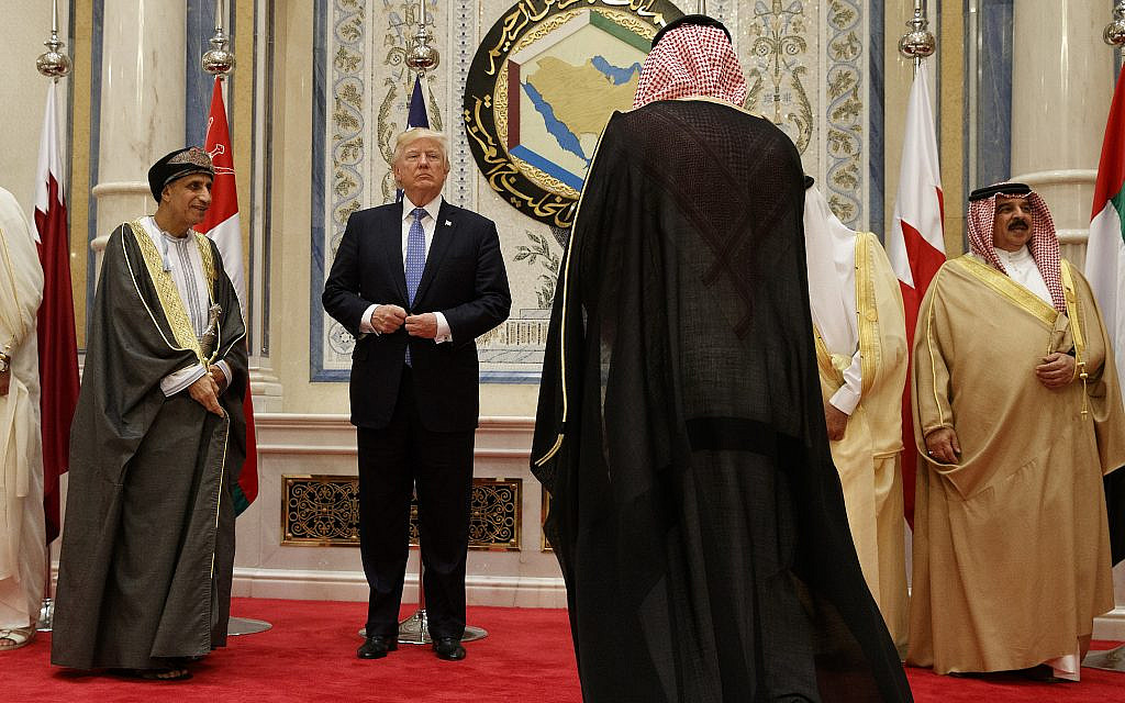 US President Donald Trump adjusts his jacket before posing for photos with leaders at the Gulf Cooperation Council meeting, at the King Abdulaziz Conference Center, May 21, 2017, in Riyadh, Saudi Arabia. (AP Photo/Evan Vucci) US President Donald Trump adjusts his jacket before posing for photos with leaders at the Gulf Cooperation Council meeting, at the King Abdulaziz Conference Center, May 21, 2017, in Riyadh, Saudi Arabia. (AP Photo/Evan Vucci)
