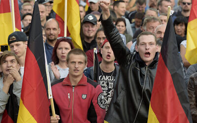 Illustrative: Far-right groups protest in Chemnitz, eastern Germany, September 7, 2018, after several nationalist groups called for marches protesting the killing of a German man allegedly by migrants from Syria and Iraq. (AP Photo/Jens Meyer)