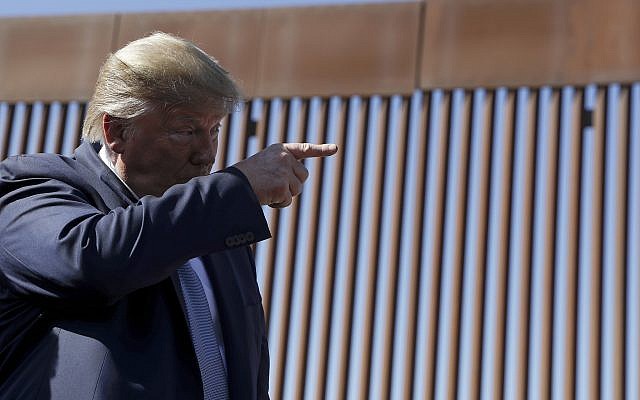 US President Donald Trump talks with reporters as he tours a section of the southern border wall, September 18, 2019, in Otay Mesa, California. (AP Photo/Evan Vucci) US President Donald Trump talks with reporters as he tours a section of the southern border wall, September 18, 2019, in Otay Mesa, California. (AP Photo/Evan Vucci)