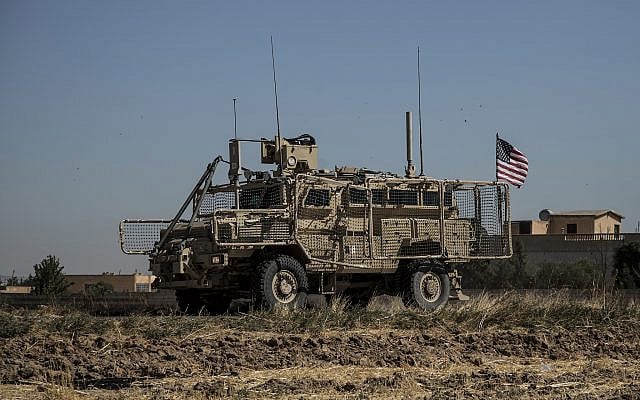 An American armored vehicle patrols with Turkish forces, as they conduct a joint ground patrol in the so-called 'safe zone' on the Syrian side of the border with Turkey, in Rahaf village, near the town of Tal Abyad, northeastern Syria, September 24, 2019. (AP Photo/Baderkhan Ahmad) An American armored vehicle patrols with Turkish forces, as they conduct a joint ground patrol in the so-called 'safe zone' on the Syrian side of the border with Turkey, in Rahaf village, near the town of Tal Abyad, northeastern Syria, September 24, 2019. (AP Photo/Baderkhan Ahmad)