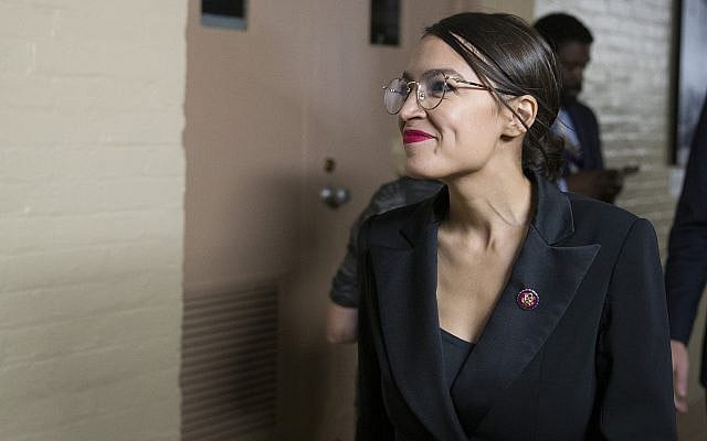 Rep. Alexandria Ocasio-Cortez, D-N.Y., smiles as House democrats arrive for a caucus meeting, Tuesday, Sept. 24, 2019 in Washington. (AP Photo/Alex Brandon) Rep. Alexandria Ocasio-Cortez, D-N.Y., smiles as House democrats arrive for a caucus meeting, Tuesday, Sept. 24, 2019 in Washington. (AP Photo/Alex Brandon)