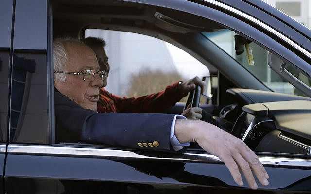 Democratic presidential candidate Sen. Bernie Sanders, I-Vt., departs Burlington International Airport after disembarking from a plane in South Burlington, Vt., on Saturday, Oct. 5, 2019. Sanders is back home in Vermont after being treated for a heart attack in Las Vegas. (AP Photo/Steven Senne) Democratic presidential candidate Sen. Bernie Sanders, I-Vt., departs Burlington International Airport after disembarking from a plane in South Burlington, Vt., on Saturday, Oct. 5, 2019. Sanders is back home in Vermont after being treated for a heart attack in Las Vegas. (AP Photo/Steven Senne)