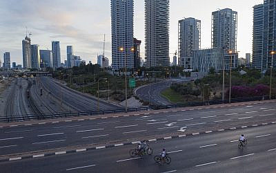 People ride their bicycles on a car-free highway on the eve of Yom Kippur in Tel Aviv, Israel, Tuesday Oct. 8, 2019. I (AP Photo/Oded Balilty)