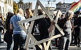 Thousands protest on October 13, 2019 in Berlin, Germany, against rising anti-Semitism, days after a gunman attacked a synagogue in the eastern German city of Halle. (Paul Zinken/dpa via AP)