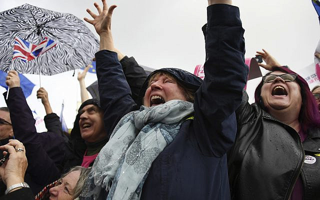 Anti-Brexit supporters cheer outside parliament in London, Oct. 19, 2019. (AP Photo/Alberto Pezzali) Anti-Brexit supporters cheer outside parliament in London, Oct. 19, 2019. (AP Photo/Alberto Pezzali)