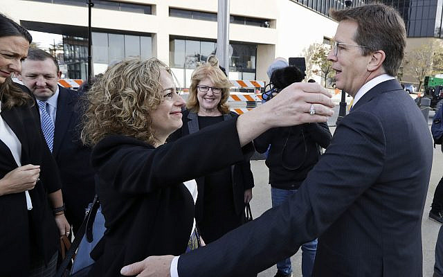 Attorneys Linda Singer and Mark Lanier hug outside the US Federal courthouse, Oct. 21, 2019, in Cleveland (AP Photo/Tony Dejak) Attorneys Linda Singer and Mark Lanier hug outside the US Federal courthouse, Oct. 21, 2019, in Cleveland (AP Photo/Tony Dejak)