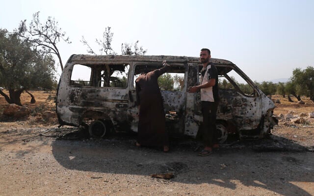 People look at a destroyed van near the village of Barisha, in Idlib province, Syria, October 27, 2019, after an operation by the US military which killed IS chief Abu Bakr al-Baghdadi. (AP/Ghaith Alsayed) People look at a destroyed van near the village of Barisha, in Idlib province, Syria, October 27, 2019, after an operation by the US military which killed IS chief Abu Bakr al-Baghdadi. (AP/Ghaith Alsayed)