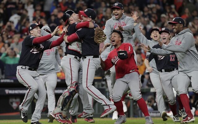 Washington Nationals' Yan Gomes and Daniel Hudson celebrate after Game 7 of the baseball World Series against the Houston Astros Wednesday, October 30, 2019, in Houston. The Nationals won 6-2 to win the series. (AP Photo/David J. Phillip) Washington Nationals' Yan Gomes and Daniel Hudson celebrate after Game 7 of the baseball World Series against the Houston Astros Wednesday, October 30, 2019, in Houston. The Nationals won 6-2 to win the series. (AP Photo/David J. Phillip)