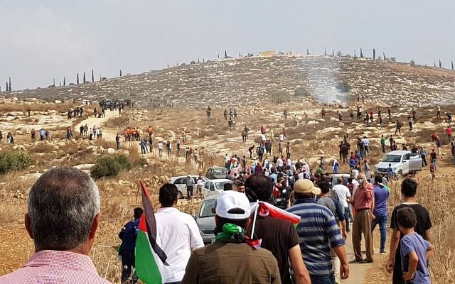 Palestinians gather during a protest march dispersed by the IDF near the Shiloh settlement on October 17, 2019. (Sharona Weiss/Yesh Din) Palestinians gather during a protest march dispersed by the IDF near the Shiloh settlement on October 17, 2019. (Sharona Weiss/Yesh Din)