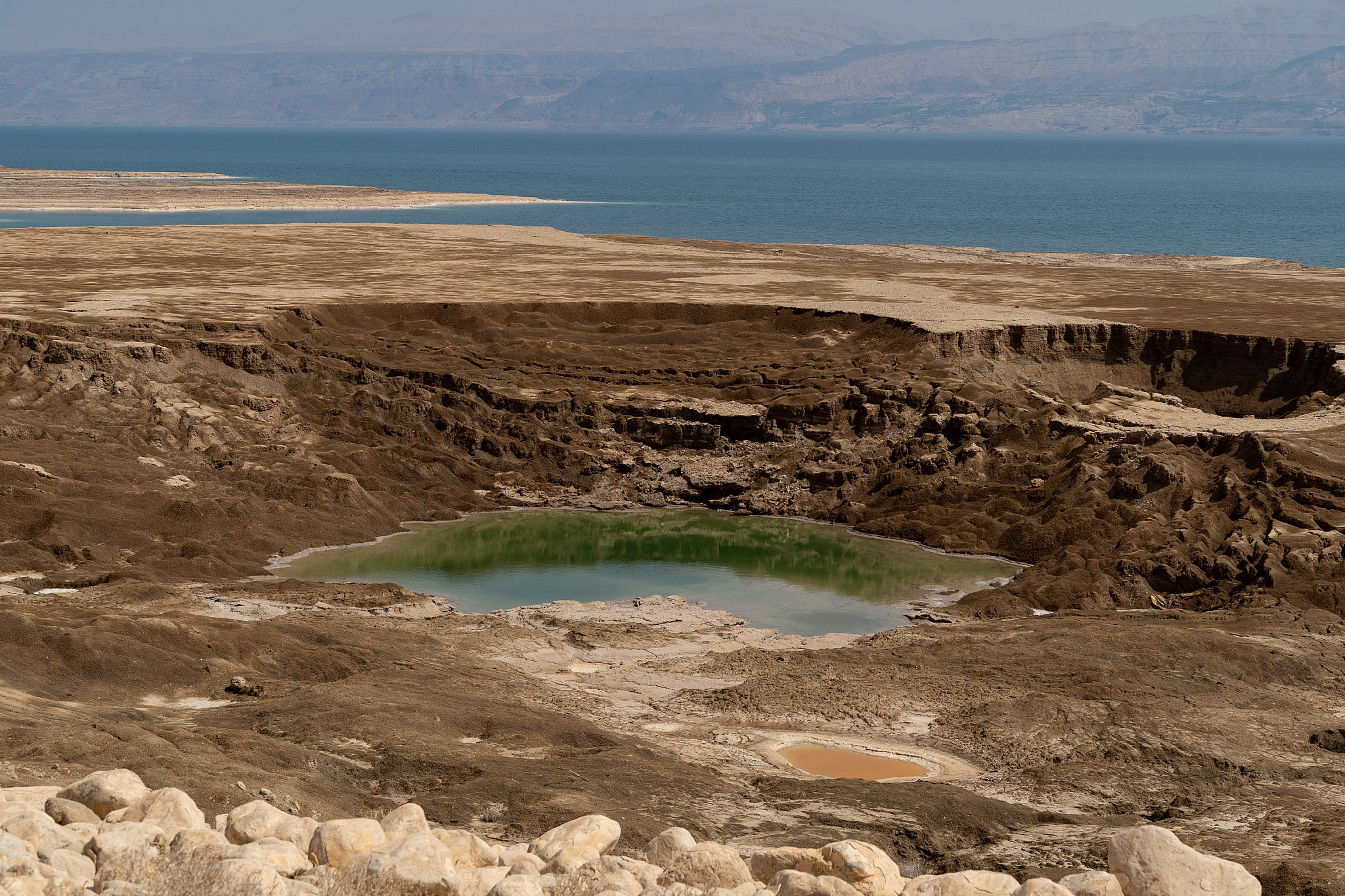 View of a sinkhole near the Dead Sea, southern Israel, October 4, 2018 . Sinkholes are a result of the continuing sea level drop of the Dead Sea.(Yaniv Nadav/FLASH90) View of a sinkhole near the Dead Sea, southern Israel, October 4, 2018 . Sinkholes are a result of the continuing sea level drop of the Dead Sea.(Yaniv Nadav/FLASH90)