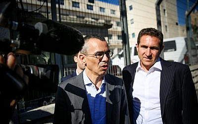 Prime Minister Benjamin Netanyahu's legal team, including attorney Yossi Ashkenazi, center, arrive at the Justice Ministry in Jerusalem for the hearing on the corruption cases in which Netanyahu is a suspect, on October 3, 2019. (Flash90)