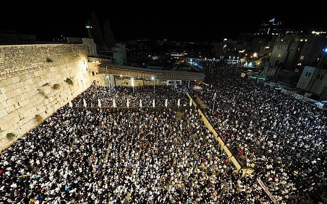 Tens of thousands pray at the Western Wall in the Old City of Jerusalem in Selichot (forgiveness) prayers, early on September 27, 2019. (Mendy Hechtman/Flash90) Tens of thousands pray at the Western Wall in the Old City of Jerusalem in Selichot (forgiveness) prayers, early on September 27, 2019. (Mendy Hechtman/Flash90)