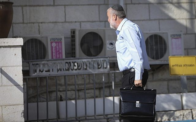 Attorney General Avichai Mandelblit arrives at Justice Ministry headquarters in Jerusalem for the start of Prime Minister Benjamin Netanyahu's pre-indictment hearings in a series of corruption cases, on October 2, 2019. (Noam Rivkin Fenton/Flash90)