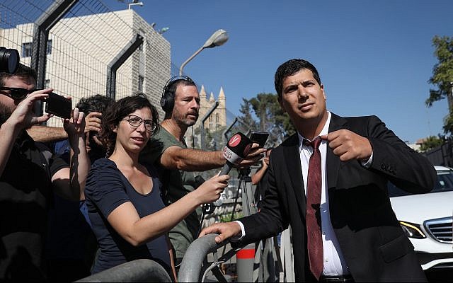 Prime Minister Benjamin Netanyahu's lawyer Amit Hadad outside the Justice Ministry headquarters on October 2, 2019, ahead of the start of Netanyahu's pre-indictment hearing. (Menahem Kahana/AFP)