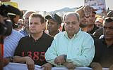 Joint List MKs Ayman Odeh (L) and Ahmad Tibi attend a protest against violence, organized crime and recent killings in the Arab communities, Majd al-Krum, October 3, 2019. (David Cohen/Flash90)