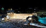 Thousands attend forgiveness prayers (Selichot) at the Western Wall in the Old City of Jerusalem early on October 8, 2019, prior to the Day of Atonement, Yom Kippur. (Yonatan Sindel/Flash90)