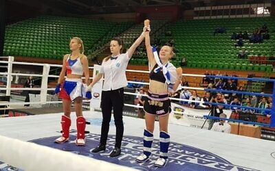 Yulia Sachkov (R) celebrates after winning a gold medal at the world kickboxing championships in Sarajevo, Bosnia, October 26, 2019. (Ayelet Federation on Non-Olympic Sport in Israel)