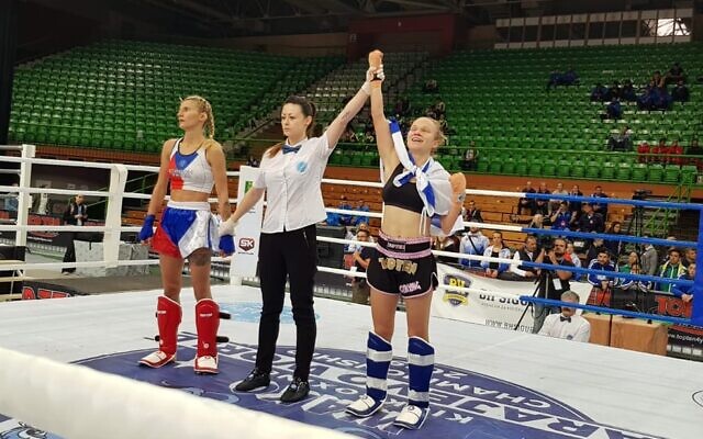 Yulia Sachkov (R) celebrates after winning a gold medal at the world kickboxing championships in Sarajevo, Bosnia, October 26, 2019. (Ayelet Federation on Non-Olympic Sport in Israel)