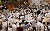 Illustrative: Secular and religious Israelis at the conclusion of Yom Kippur services in the community center in Kiryat Ono, near Tel Aviv (Courtesy of Tzohar)