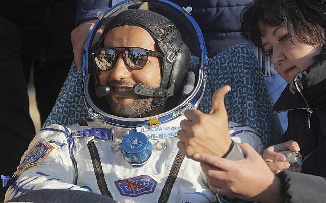 United Arab Emirates astronaut Hazzaa al-Mansoori gestures shortly after the landing in a space capsule about 150 km (90 miles) south-east of the Kazakh town of Dzhezkazgan, on October 3, 2019. (Dmitri Lovetsky/Pool/AFP) United Arab Emirates astronaut Hazzaa al-Mansoori gestures shortly after the landing in a space capsule about 150 km (90 miles) south-east of the Kazakh town of Dzhezkazgan, on October 3, 2019. (Dmitri Lovetsky/Pool/AFP)