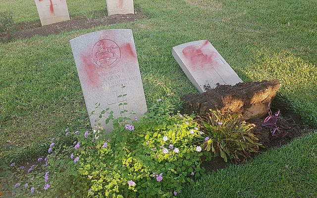 Vandalized graves in a Commonwealth military cemetery in Haifa, October 11, 2019. (Israel police) Vandalized graves in a Commonwealth military cemetery in Haifa, October 11, 2019. (Israel police)
