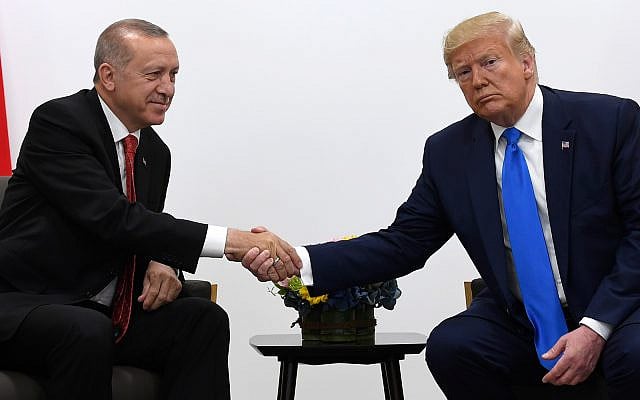 US President Donald Trump, right, shakes hands with Turkish President Recep Tayyip Erdogan, left, during a meeting on the sidelines of the G-20 summit in Osaka, Japan, June 29, 2019. (AP Photo/Susan Walsh) US President Donald Trump, right, shakes hands with Turkish President Recep Tayyip Erdogan, left, during a meeting on the sidelines of the G-20 summit in Osaka, Japan, June 29, 2019. (AP Photo/Susan Walsh)