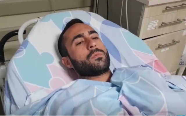 Elazar Hazut, who was wounded by a lightning strike, speaks to reporters from his hospital bed at the Barzilai medical center on October 15, 2019. (Screen capture/Ynet) Elazar Hazut, who was wounded by a lightning strike, speaks to reporters from his hospital bed at the Barzilai medical center on October 15, 2019. (Screen capture/Ynet)