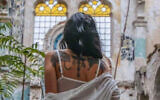A model in a dilapidated Romanian synagogue. (Edy Rosen/Facebook via JTA)