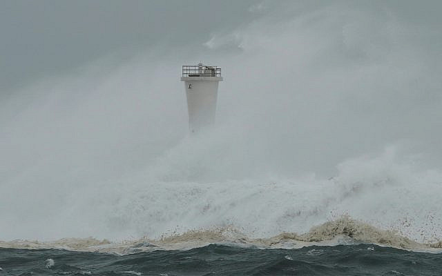 Illustration: Surging waves hit against the breakwater and a lighthouse as Typhoon Hagibis approaches at a port in town of Kiho, Mie prefecture, central Japan, October 12, 2019. (AP Photo/Toru Hanai) Illustration: Surging waves hit against the breakwater and a lighthouse as Typhoon Hagibis approaches at a port in town of Kiho, Mie prefecture, central Japan, October 12, 2019. (AP Photo/Toru Hanai)