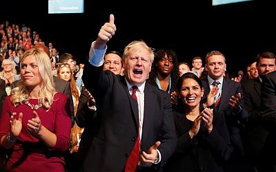 UK Prime Minister Boris Johnson gives a thumb up after Sajid Javid, Chancellor of the Exchequer, delivered his speech at the Conservative Party Conference in Manchester, England, September 30, 2019.(AP Photo/Frank Augstein)