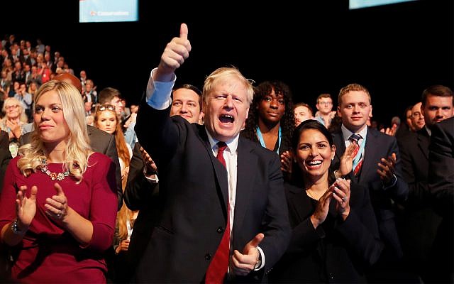 UK Prime Minister Boris Johnson gives a thumb up after Sajid Javid, Chancellor of the Exchequer, delivered his speech at the Conservative Party Conference in Manchester, England, September 30, 2019.(AP Photo/Frank Augstein) UK Prime Minister Boris Johnson gives a thumb up after Sajid Javid, Chancellor of the Exchequer, delivered his speech at the Conservative Party Conference in Manchester, England, September 30, 2019.(AP Photo/Frank Augstein)