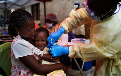 A child is vaccinated against Ebola in Beni, DRC, July 13, 2019. (AP Photo/Jerome Delay, file)