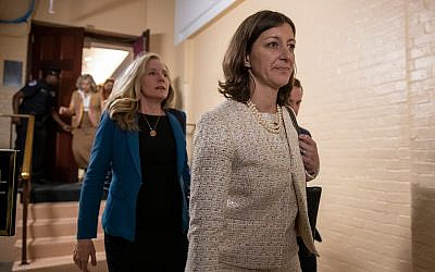 Representative Elaine Luria, right, followed by Representative Abigail Spanberger, left, leave a House Democratic Caucus meeting with Speaker of the House Nancy Pelosi where she was persuaded to launch a formal impeachment inquiry against US President Donald Trump, at the Capitol in Washington, September 24, 2019. (AP Photo/J. Scott Applewhite)