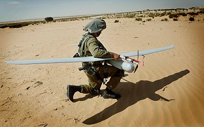 Illustrative: An IDF soldier with a Skylark drone during a drill at the Tzelim army base, August 5, 2013. (Miriam Alster/Flash90)