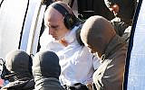 Stephan Balliet, the suspect in the Halle shooting, gets out of a helicopter at the Federal Supreme Court in Karlsruhe, southern Germany, October 10, 2019. (Uli Deck/dpa/AFP)
