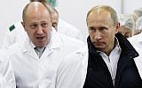 Russian businessman Yevgeny Prigozhin, left, shows Russian President Vladimir Putin, right, around his factory outside St. Petersburg, Russia, September 20, 2010. (Alexei Druzhinin/Pool Photo via AP, File)