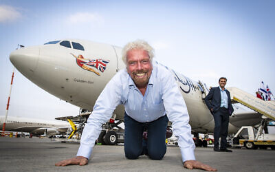 Virgin Atlantic founder Richard Branson kisses the ground as he touches down at Ben Gurion Airport in Tel Aviv, Israel.    (Courtesy Virgin)