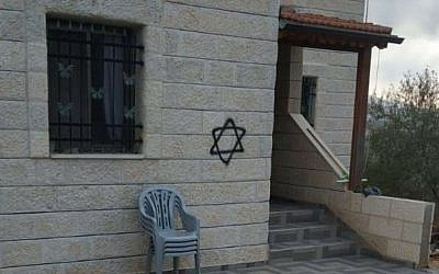 A Star of David spray-painted on the wall of a Palestinian home in Qira in an apparent price tag attack on October 6, 2019. (Ouhoud Khafash/Yesh/Din)