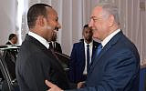 Prime Minister Benjamin Netanyahu (R) shakes hands with Ethiopian Prime Minister Abiy Ahmed in Jerusalem on September 1, 2019. (Amos Ben Gershom/PMO)