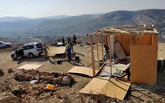 Civil Administration workers demolish two structures in the Shevah Ha'aretz illegal outpost near Yitzhar on October 24, 2019. (Courtesy) Civil Administration workers demolish two structures in the Shevah Ha'aretz illegal outpost near Yitzhar on October 24, 2019. (Courtesy)