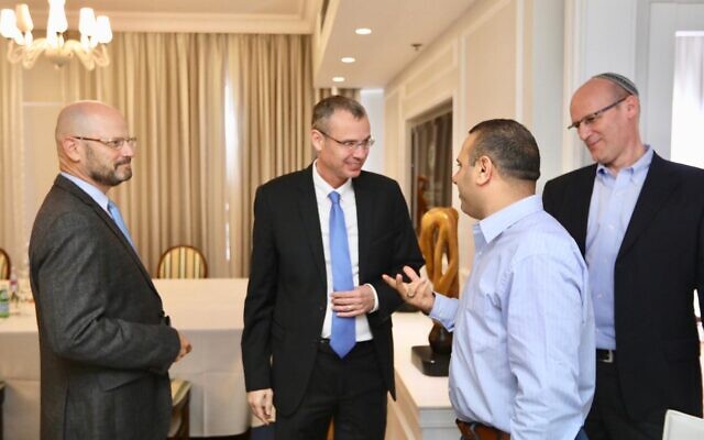 Blue and White coalition negotiators Yoram Turbowicz (L) and Shalom Shlomo (second from R) along with Likud's negotiators Tourism Minister Yariv Levin (second from L) and Michael Rabello (R) meet in Kfar Maccabiah on October 27, 2019. (Elad Malkah) Blue and White coalition negotiators Yoram Turbowicz (L) and Shalom Shlomo (second from R) along with Likud's negotiators Tourism Minister Yariv Levin (second from L) and Michael Rabello (R) meet in Kfar Maccabiah on October 27, 2019. (Elad Malkah)