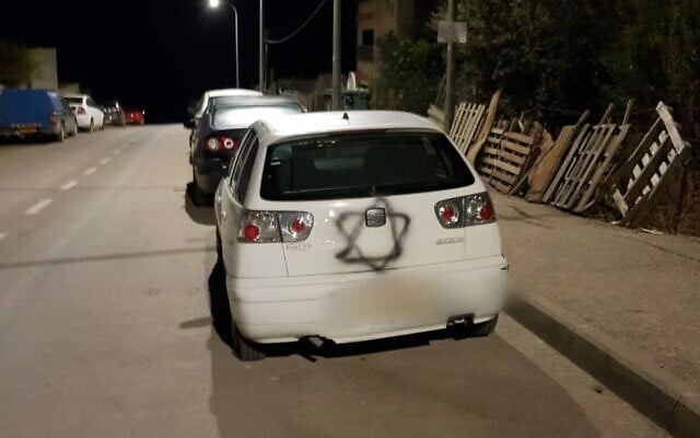 A Star of David sprayed on a car in an Arab neighborhood of the northern city of Safed, October 31, 2019. (Israel Police) A Star of David sprayed on a car in an Arab neighborhood of the northern city of Safed, October 31, 2019. (Israel Police)